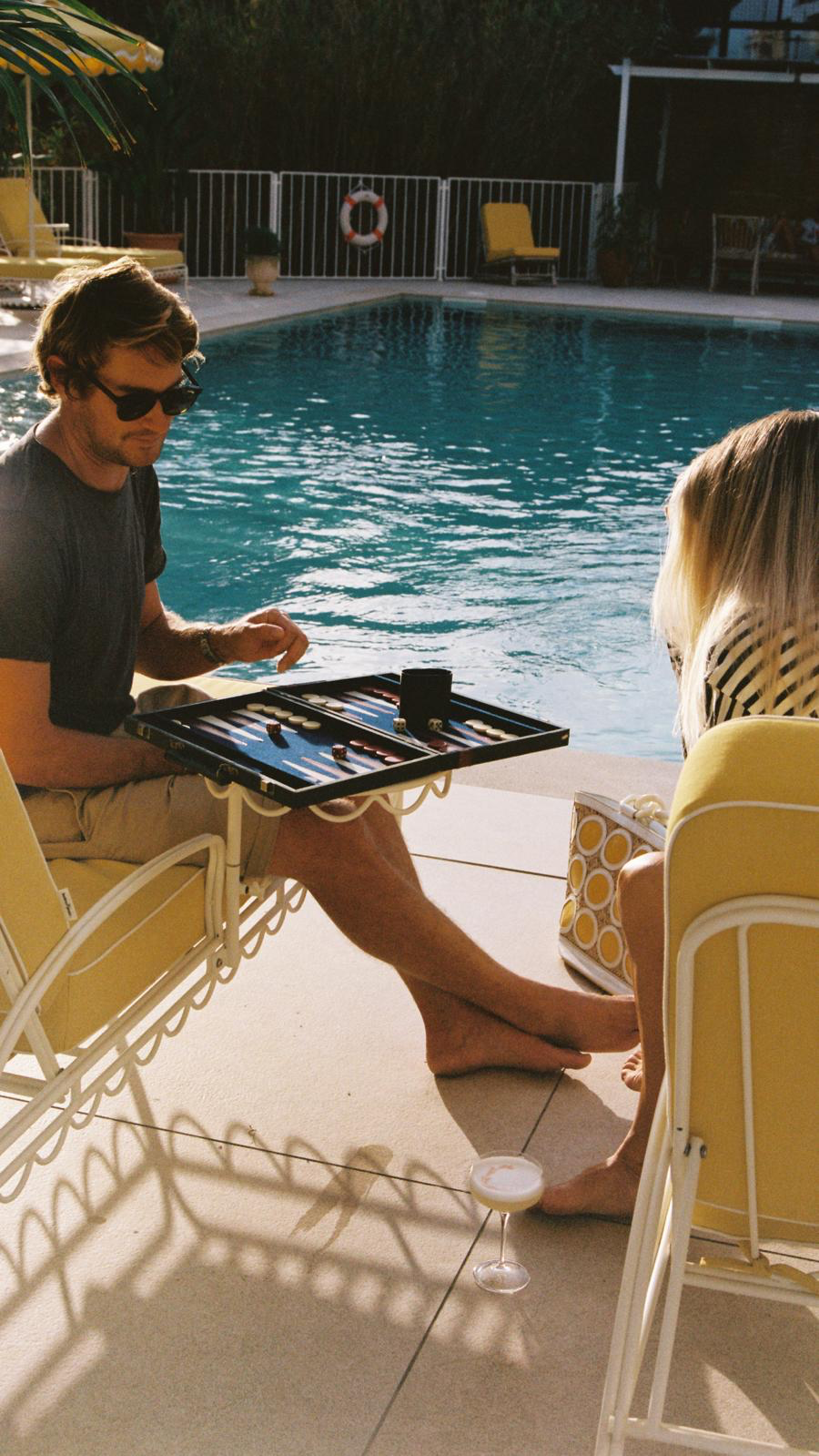 Poolside loungers with terracotta umbrellas