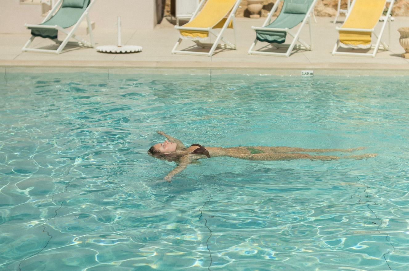 Members relaxing beside the outdoor pool